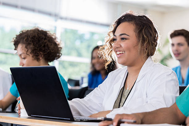 istock Mixed race medical student uses laptop in class 637181838