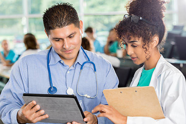 istock Confident healthcare professionals discuss something 637181924
