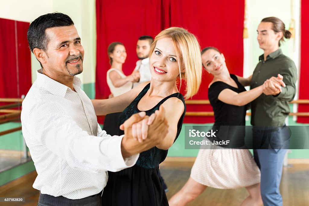 Happy adults  enjoying of classical dance Happy elegant adults  enjoying of classical dance in class Dancing Stock Photo