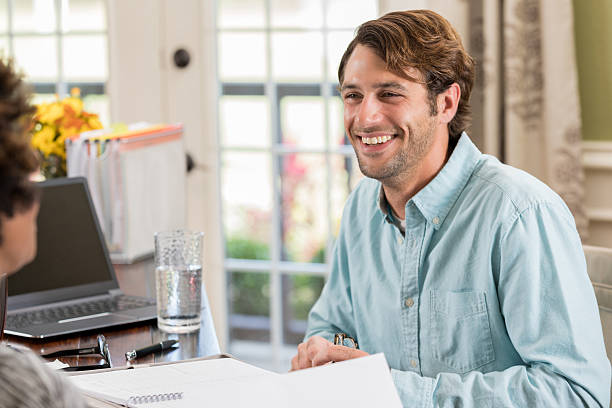istock Cheerful businessman works with colleage 637183266