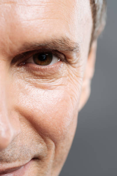 istock Close up of handsome doctors face smiling on grey background 637184610