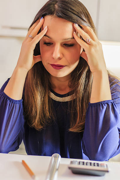 istock Close up of businesswoman hands using calculator 637186696
