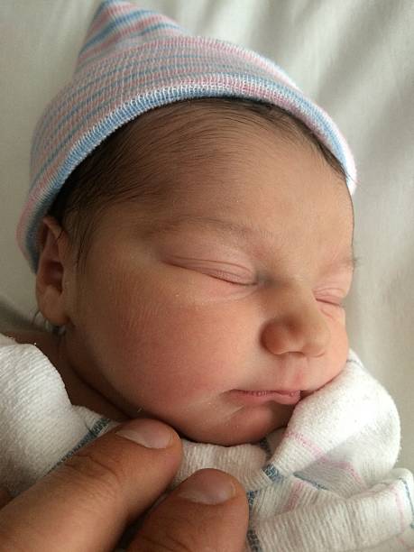 istock Newborn with Hospital Beanie 637187650