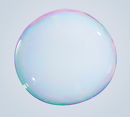 Iredescent Soap bubble on a white/grey background