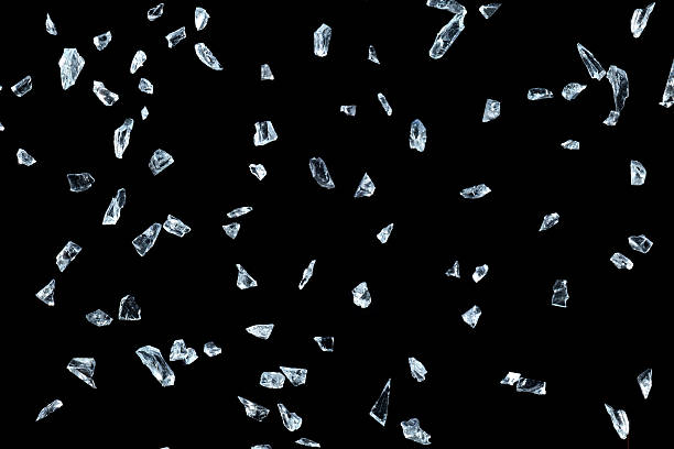 istock Shattered glass pieces on black background 637189350