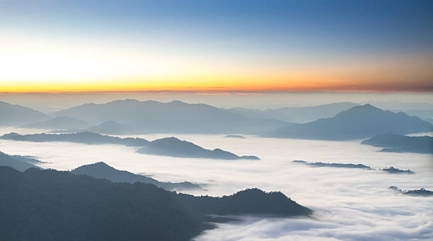 istock morning sunrise with fog 637189970