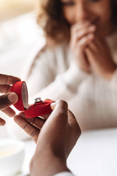 istock Young African American man making an engagement proposal 637191300