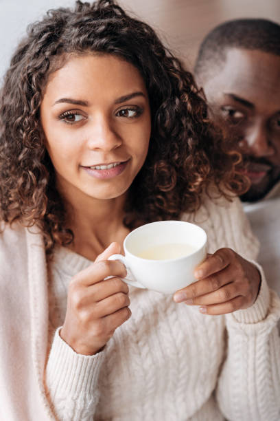 istock Pleasant African American couple drinking tea in the cafe 637191642