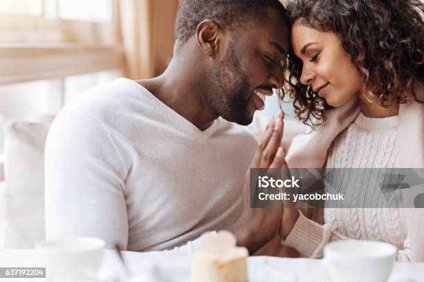 Passionate African American Couple Touching Hands In The Cafe Stock Photo - Download Image Now