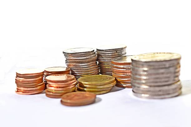 istock Many stacks of coins in various sizes and valued 637194274