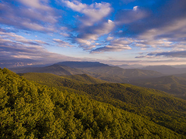 istock Mountain forest and cloudy sky in the evening. 637197578