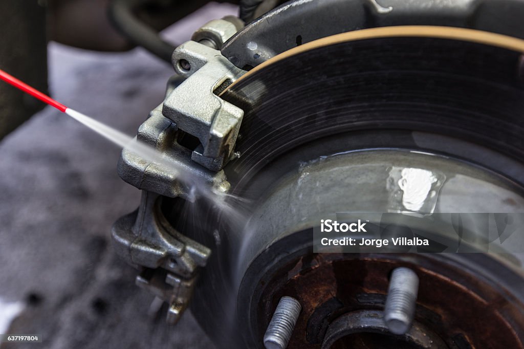 Cleaning car brake pad and disc with caliper Brake Stock Photo