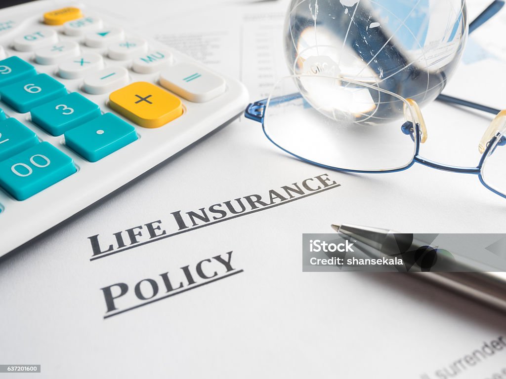 life insurance policy life insurance policy on the desk. Advice Stock Photo