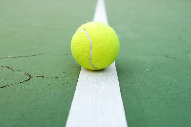 istock Tennis Ball on the Court 637207532