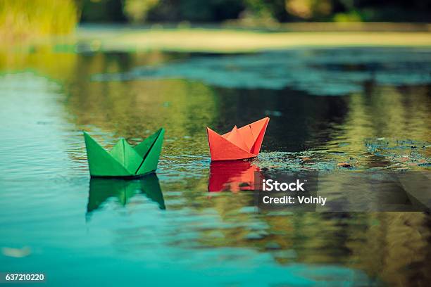 Paper Boat On The River Freedom Wave Stock Photo - Download Image Now - Child, Toy Boat, Blue