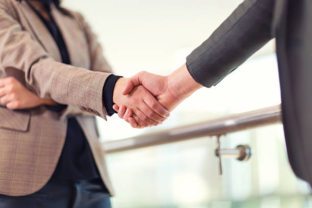 istock Business woman giving a handshake 637210594