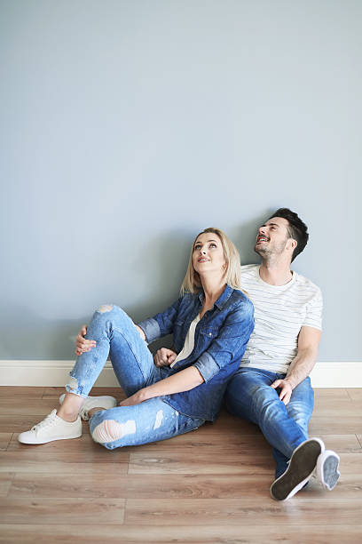 istock Young couple admiring home interior 637211712