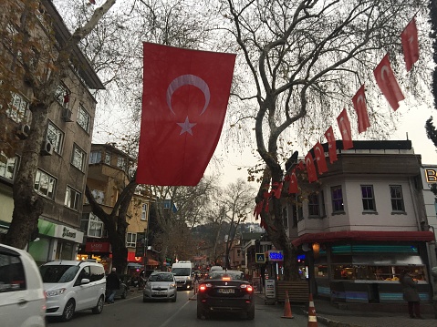 Istanbul, Turkey - December, 20th, 2016: a look at the traffic jam in one of Istanbul's districts where the streets and buildings are decorated in patriotic style with Turkish national flags which is more common after coup attempt of July, 15th, 2016. 