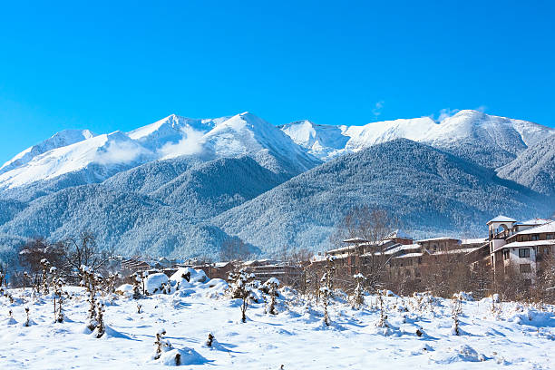istock Mountains peaks and blue sky with clouds background 637214202