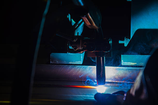 istock Welding robots movement in a car factory 637214376