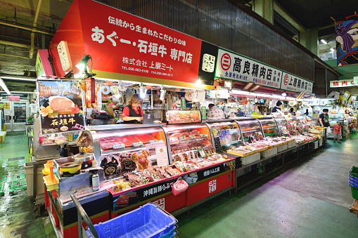 Naha, Okinawa Prefecture, Japan - August 10, 2015: All kinds of meat sales, for sale in the wholesale Market in Naha, Japan. First Makishi Public Market, is Okinawa's largest seafood market and beef meat market.