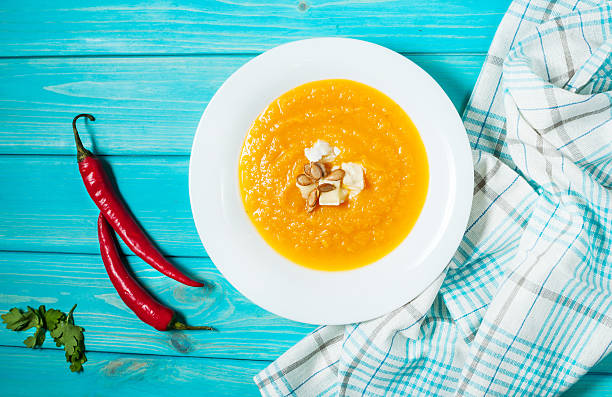 pumpkin soup on a blue wood background