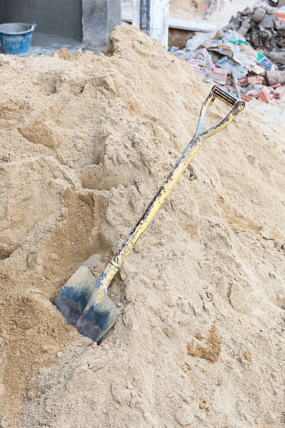 istock Old shovel on sand pile 637220008