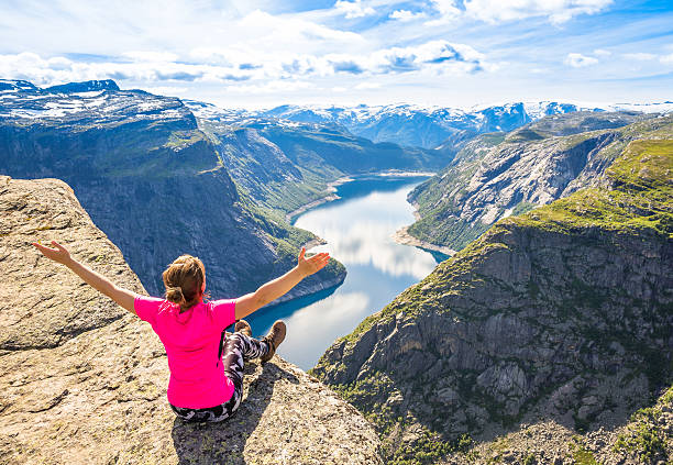 istock Happy people relax in cliff during trip Norway. Trolltunga hiking 637220602