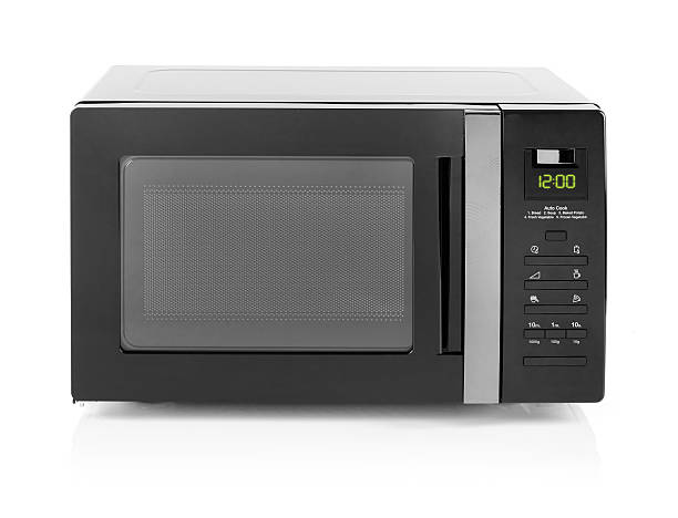 istock Microwave oven isolated on white 637221980