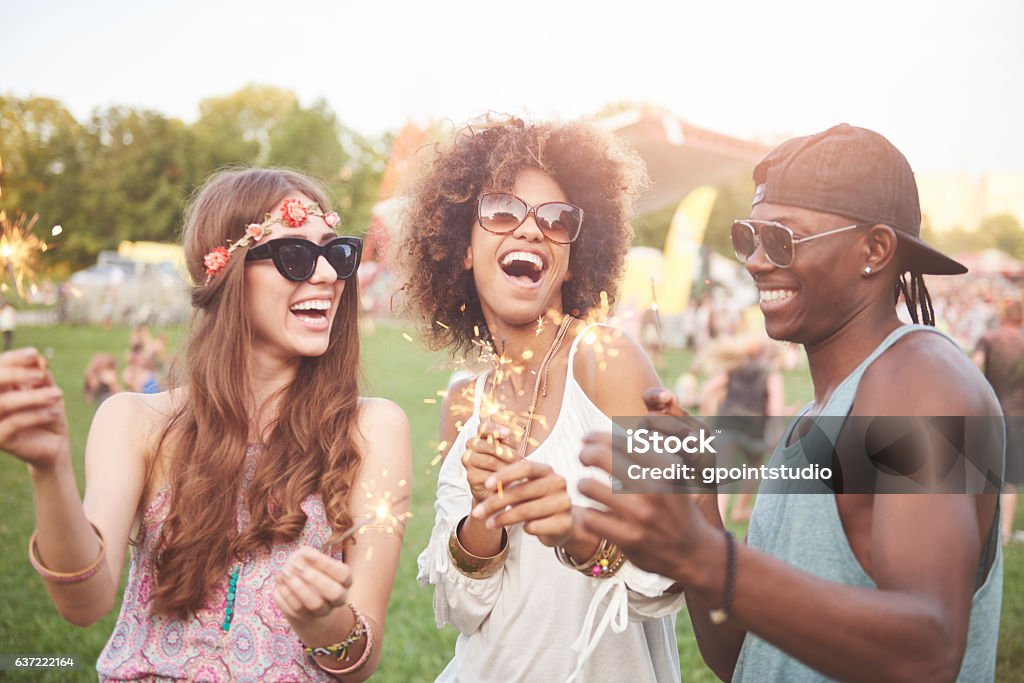 Lights of sparklers are shining in daylight Music Festival Stock Photo