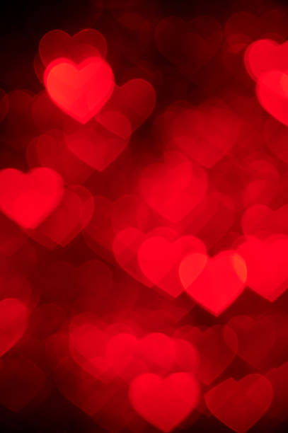 istock red heart bokeh background photo, abstract holiday backdrop 637223574