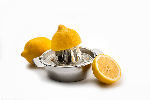 istock citrus juicer with one squeezed lemon on white 637223886