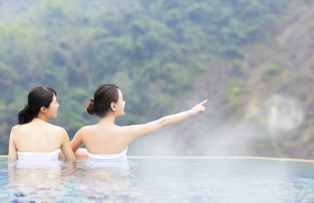 happy young woman relaxing in  hot springs
