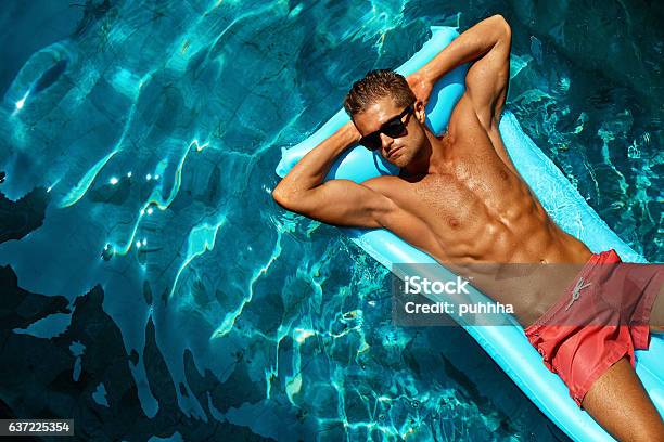 Summer Man Body Care Beautiful Male Relaxing In Pool Stock Photo - Download Image Now