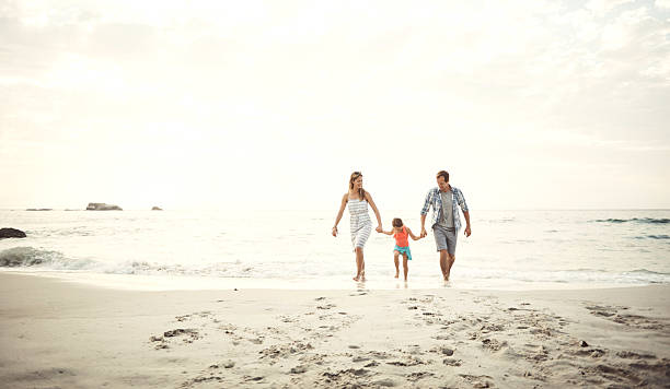 istock Enjoying time at the beach as a family 637225496