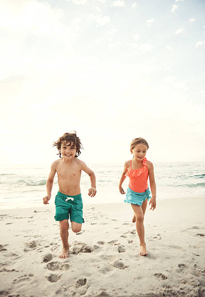 istock Racing the waves at the beach 637225536