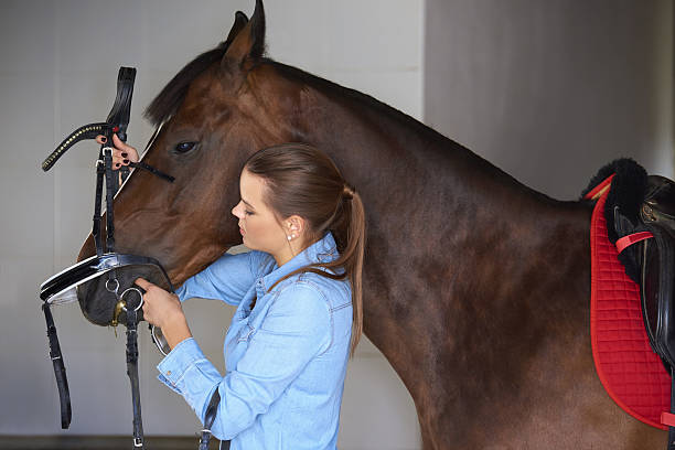 istock Young woman with her horse 637226104