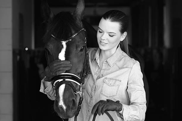 istock Attractive young female with her horse 637226200