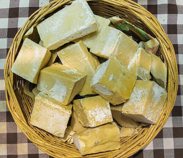 Top view of yellow organic handmade soaps in a basket stock photo