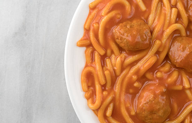 istock Plate of spaghetti and meatballs on a marble table 637227856