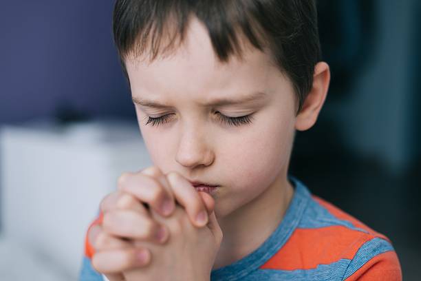 istock Little boy praying. Boy's prayer. 637228402