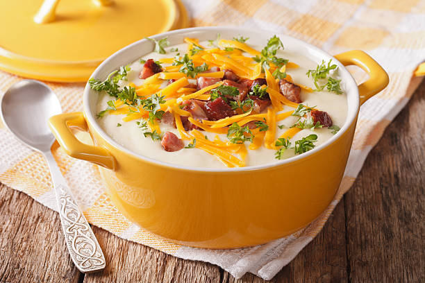 istock Delicious cream potato soup with bacon and cheddar cheese close-up 637228466