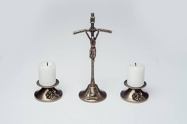 istock cross, candles and sprinkler 637228482