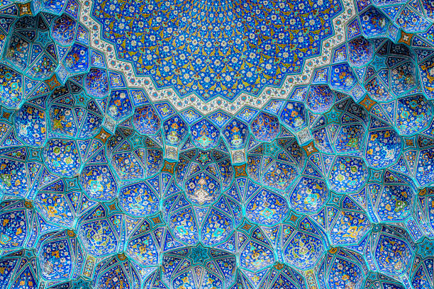 Tilework at Shah Mosque on Imam Square, Isfahan, Iran Ceiling and wall tilework at the Shah Mosque on Imam Square, Isfahan, Iran. The mosque is also known as Imam Mosque and Jaame' Abbasi Mosque. It is one of the masterpieces of Iranian/Persian Architecture and an excellent example of Islamic era architecture of Iran and also one of the top sights of the contry. mosque photos stock pictures, royalty-free photos & images