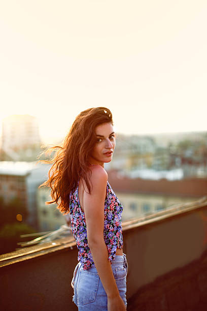 istock Girl on the roof 637230348