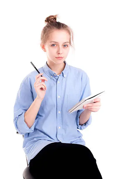 Photo of Smart student girl thinking about message isolated