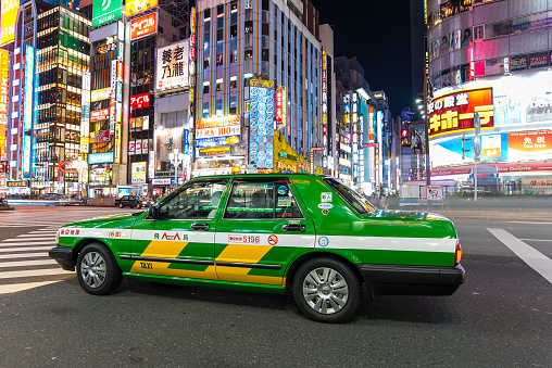 Tokyo, Japan - December 29, 2016: Taxi car driving in Tokyo in Japan