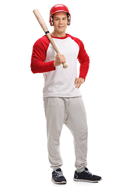 istock Male baseball player posing with a bat 637231956