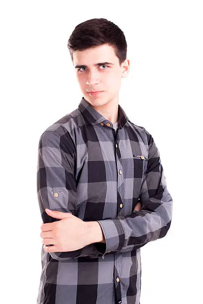 Photo of Handsome model boy posing isolated