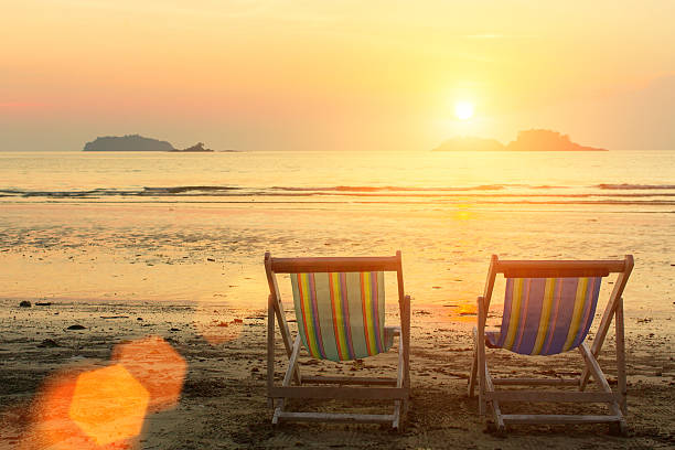 istock Sun loungers on the sea beach during sunset. 637235770
